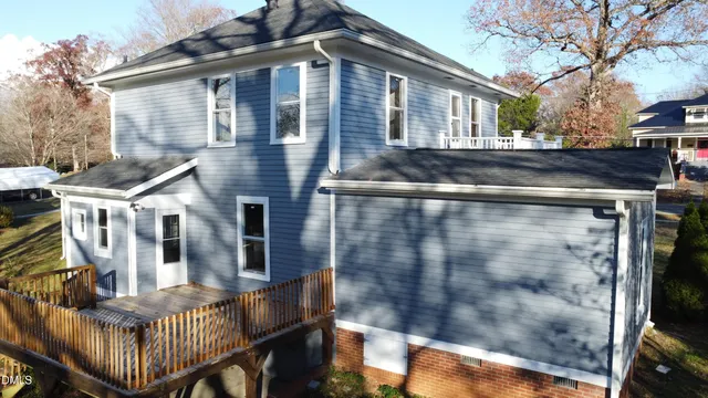 an empty room with wooden floor and closet
