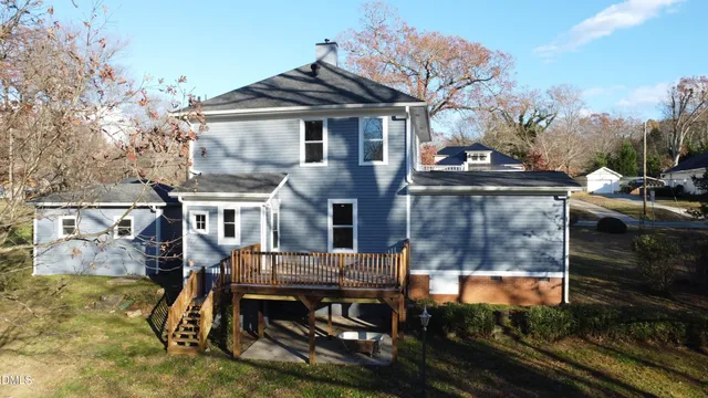an empty room with wooden floor and cabinet