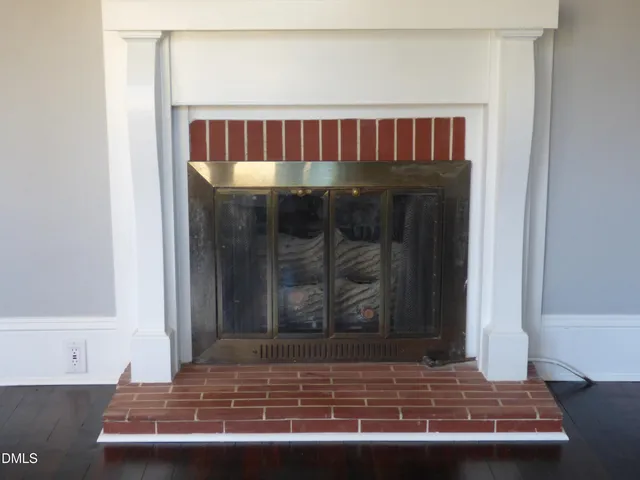 a view of a room with wooden floor and window