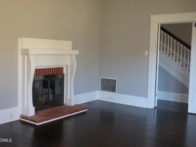 a kitchen with a refrigerator and a stove top oven