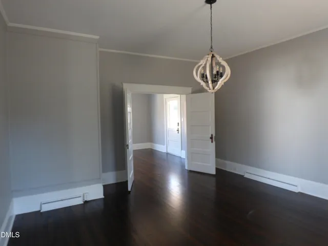 a view of entryway with a window and wooden floor