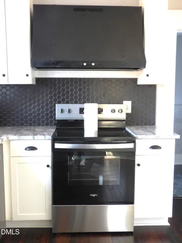 a view of storage and utility room with windows
