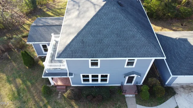 a aerial view of a house with a yard