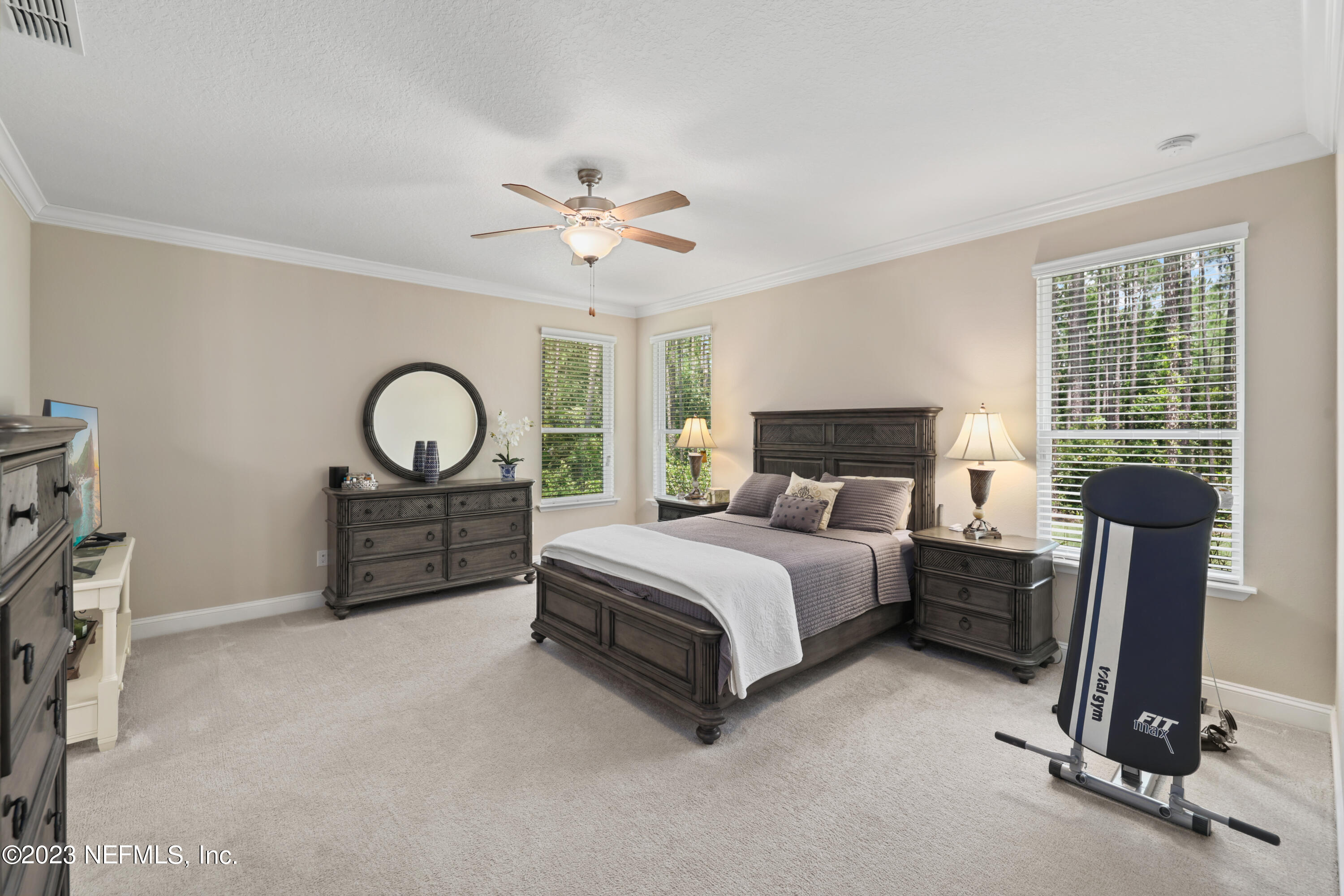 370 Coco Point St. Augustine, FL 32092 - Photo 20 of 48 a spacious bedroom with a bed and window
