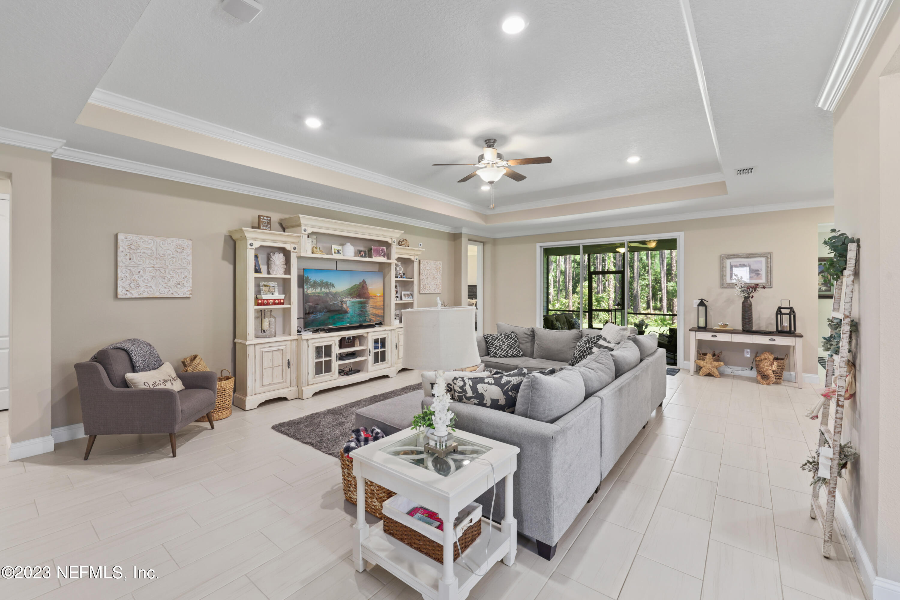 370 Coco Point St. Augustine, FL 32092 - Photo 2 of 48 a living room with furniture and a flat screen tv
