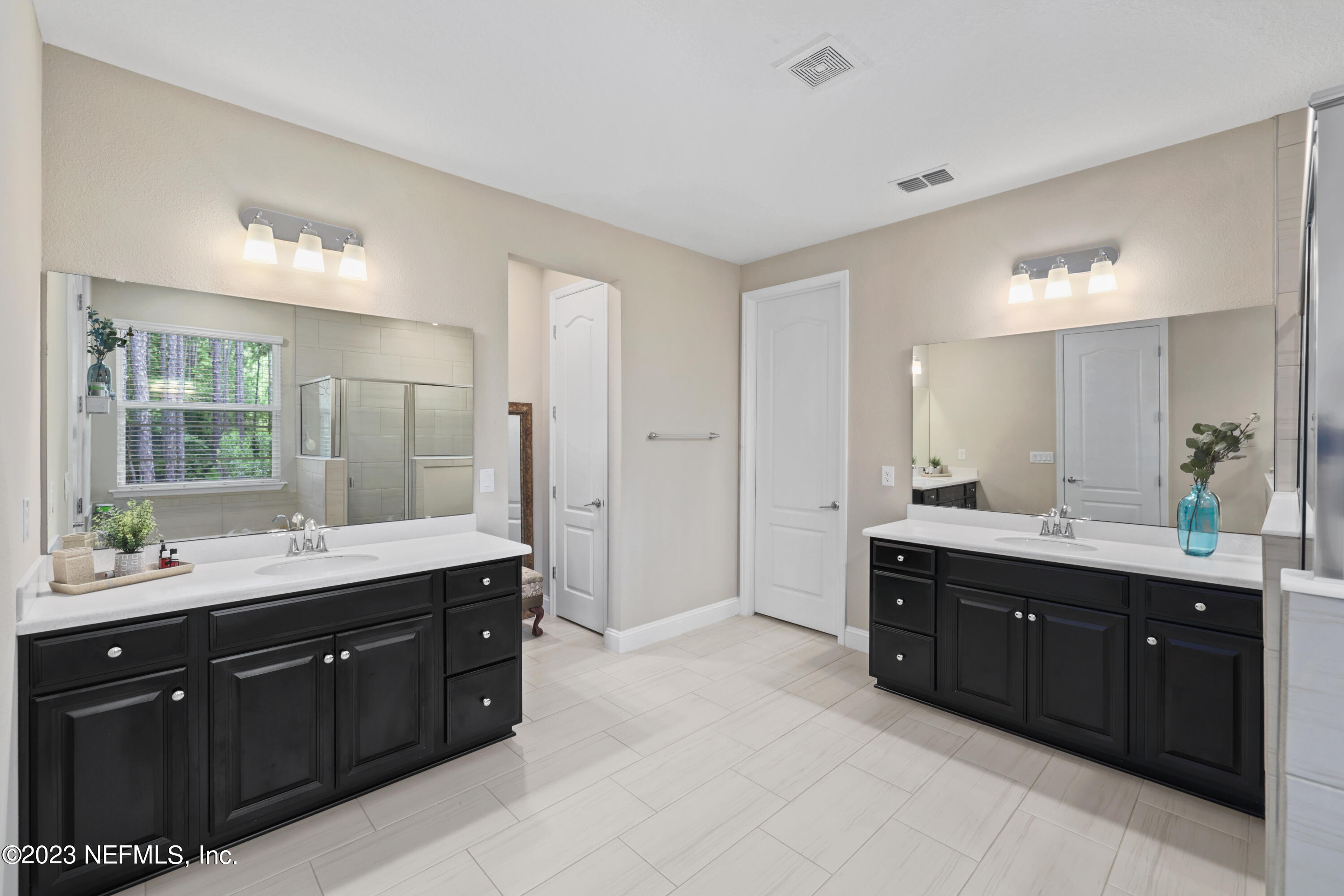 370 Coco Point St. Augustine, FL 32092 - Photo 23 of 48 a spacious bathroom with a double vanity sink mirror and double