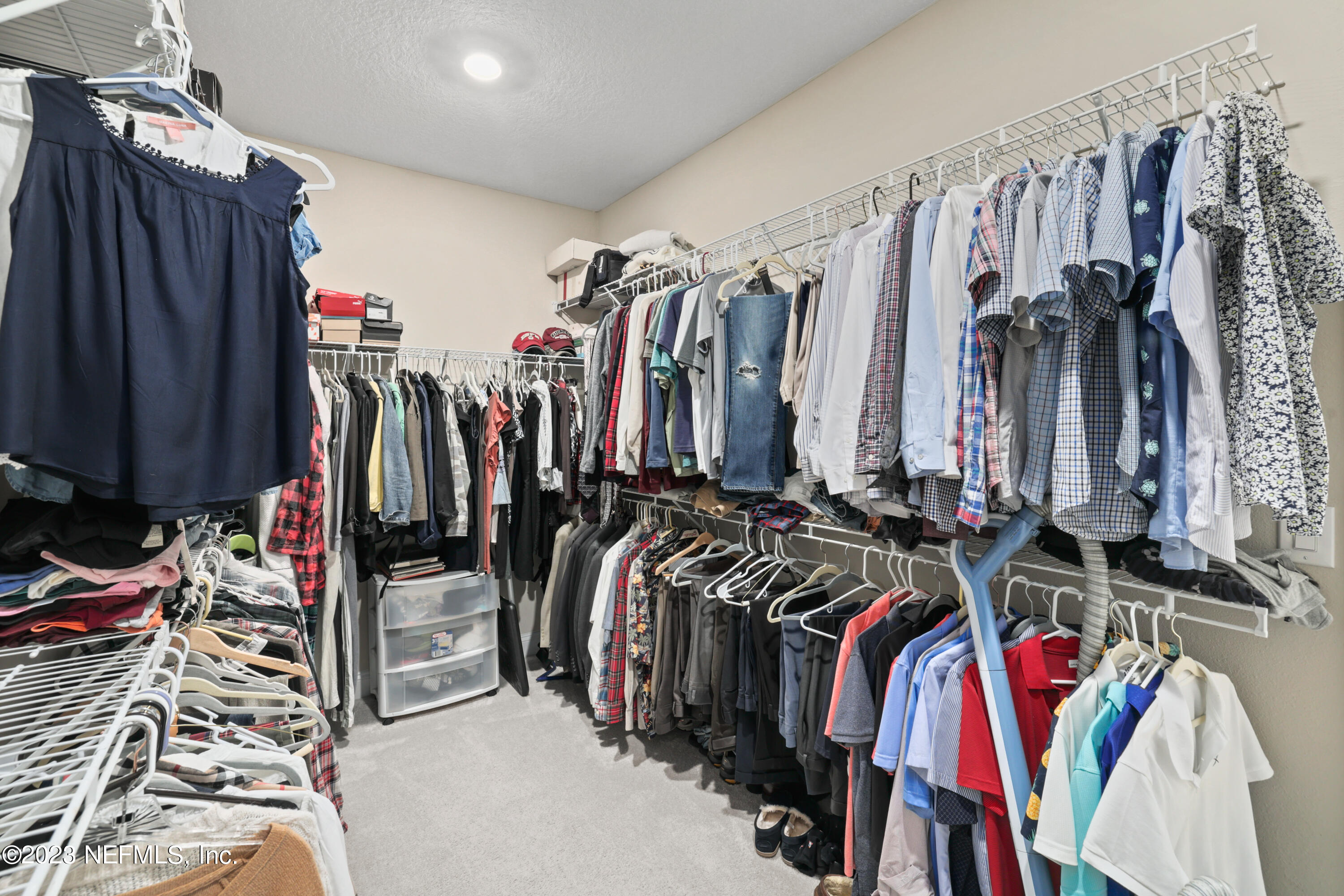 370 Coco Point St. Augustine, FL 32092 - Photo 24 of 48 a view of walk in closet with clothes