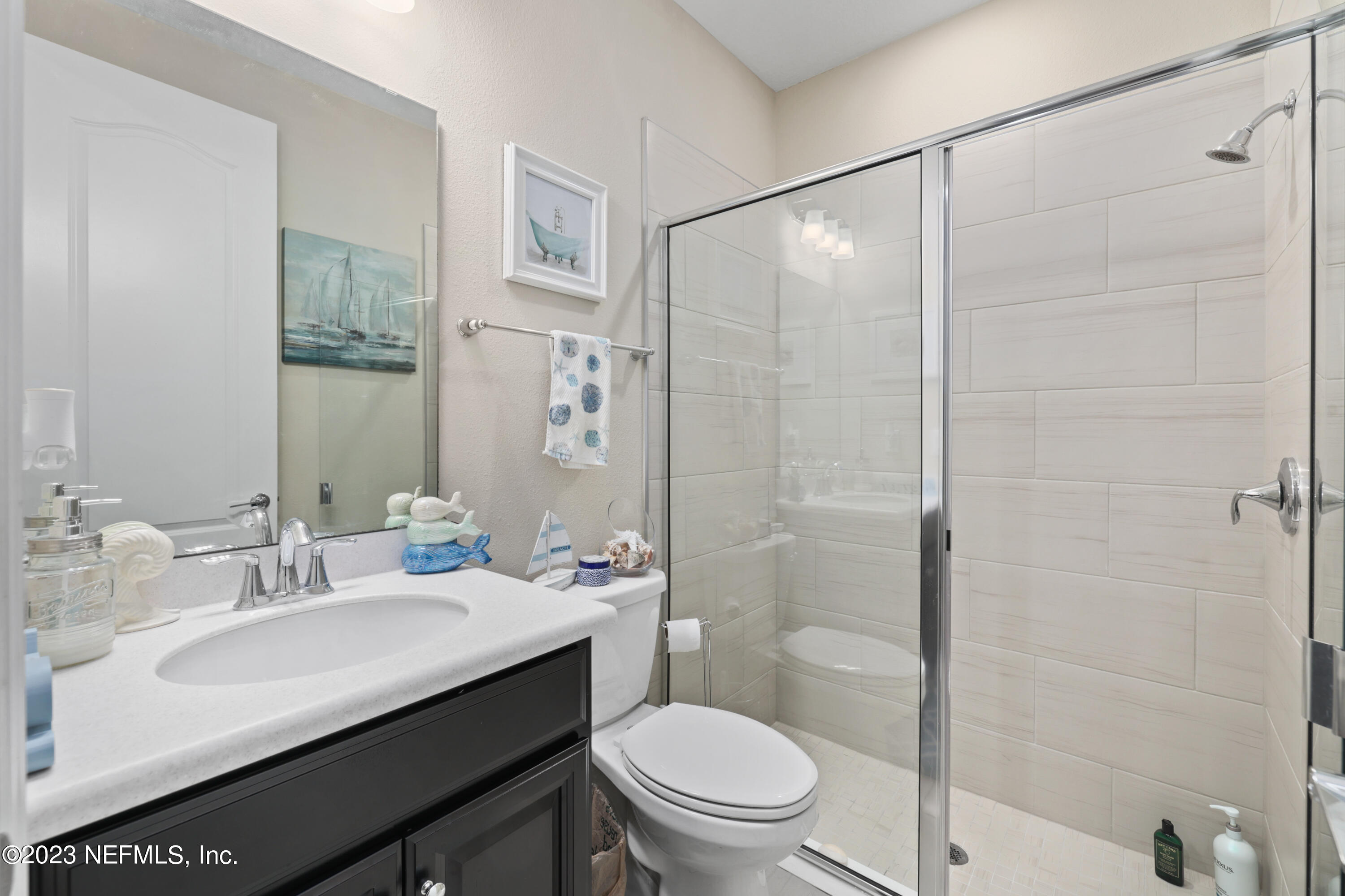 370 Coco Point St. Augustine, FL 32092 - Photo 26 of 48 a bathroom with a sink a toilet and shower