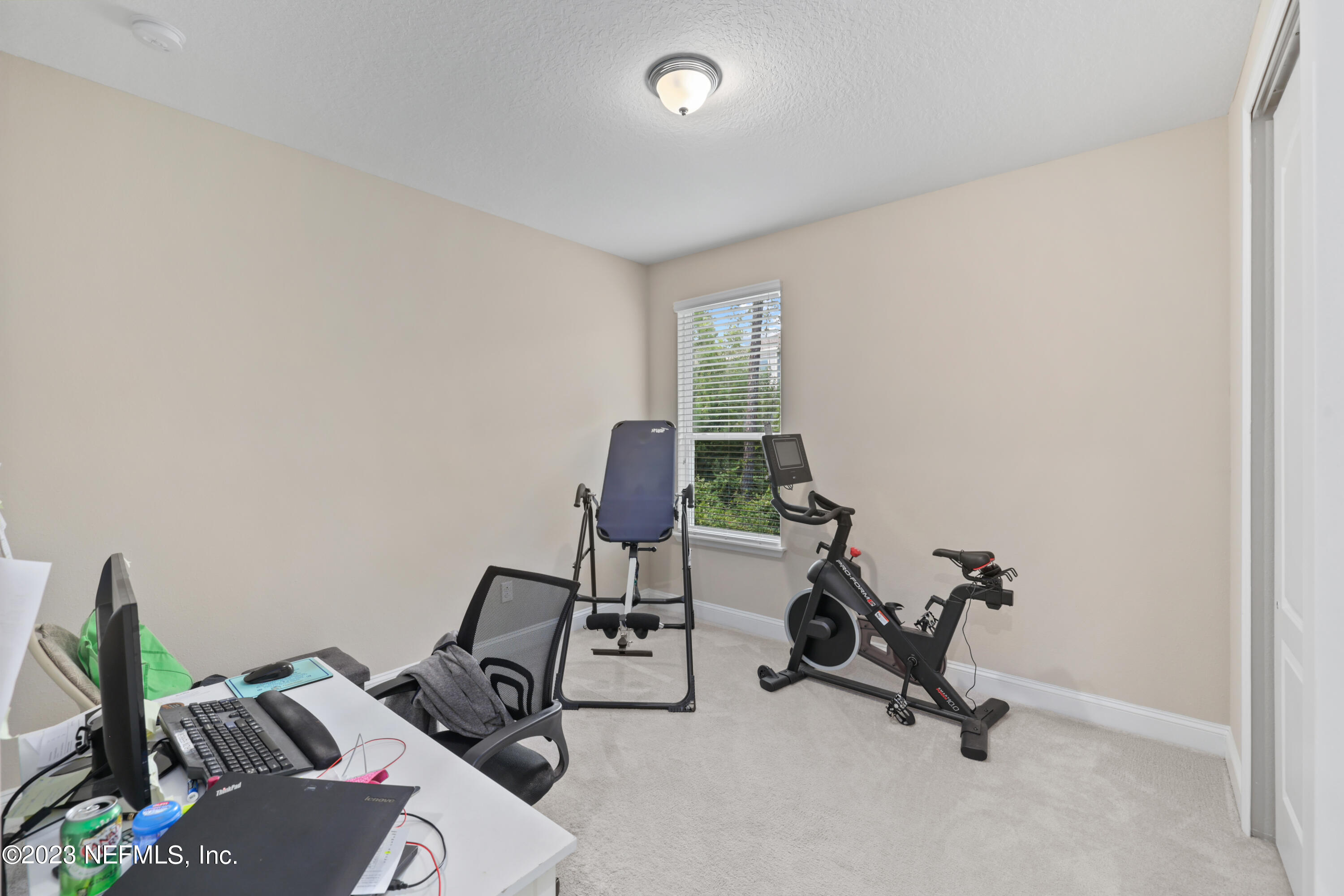 370 Coco Point St. Augustine, FL 32092 - Photo 27 of 48 a view of a workspace with furniture and a window