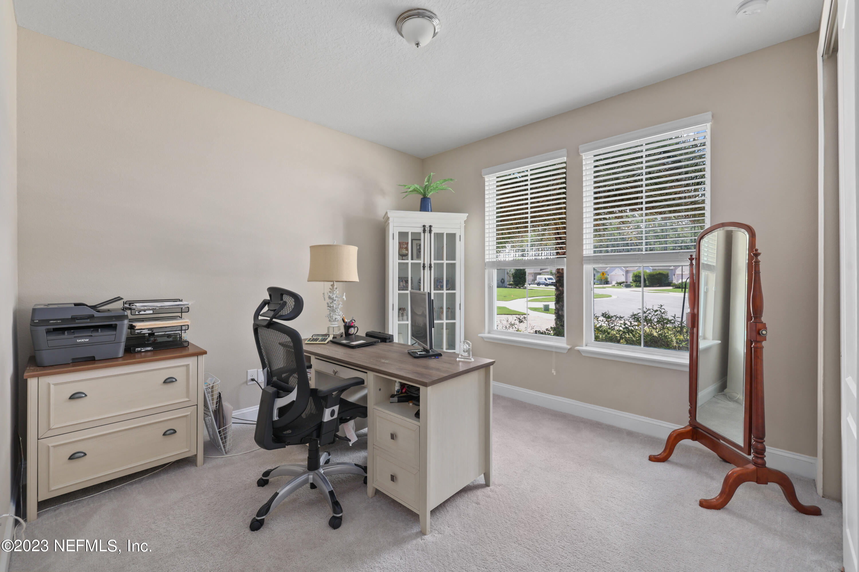 370 Coco Point St. Augustine, FL 32092 - Photo 28 of 48 a view of a workspace with furniture and a window