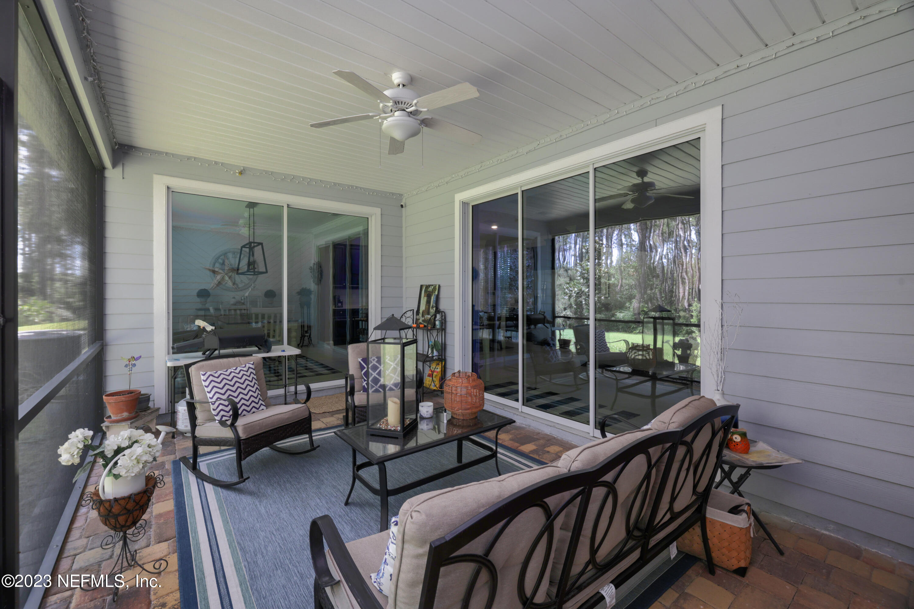 370 Coco Point St. Augustine, FL 32092 - Photo 32 of 48 a living room with furniture and wooden floor
