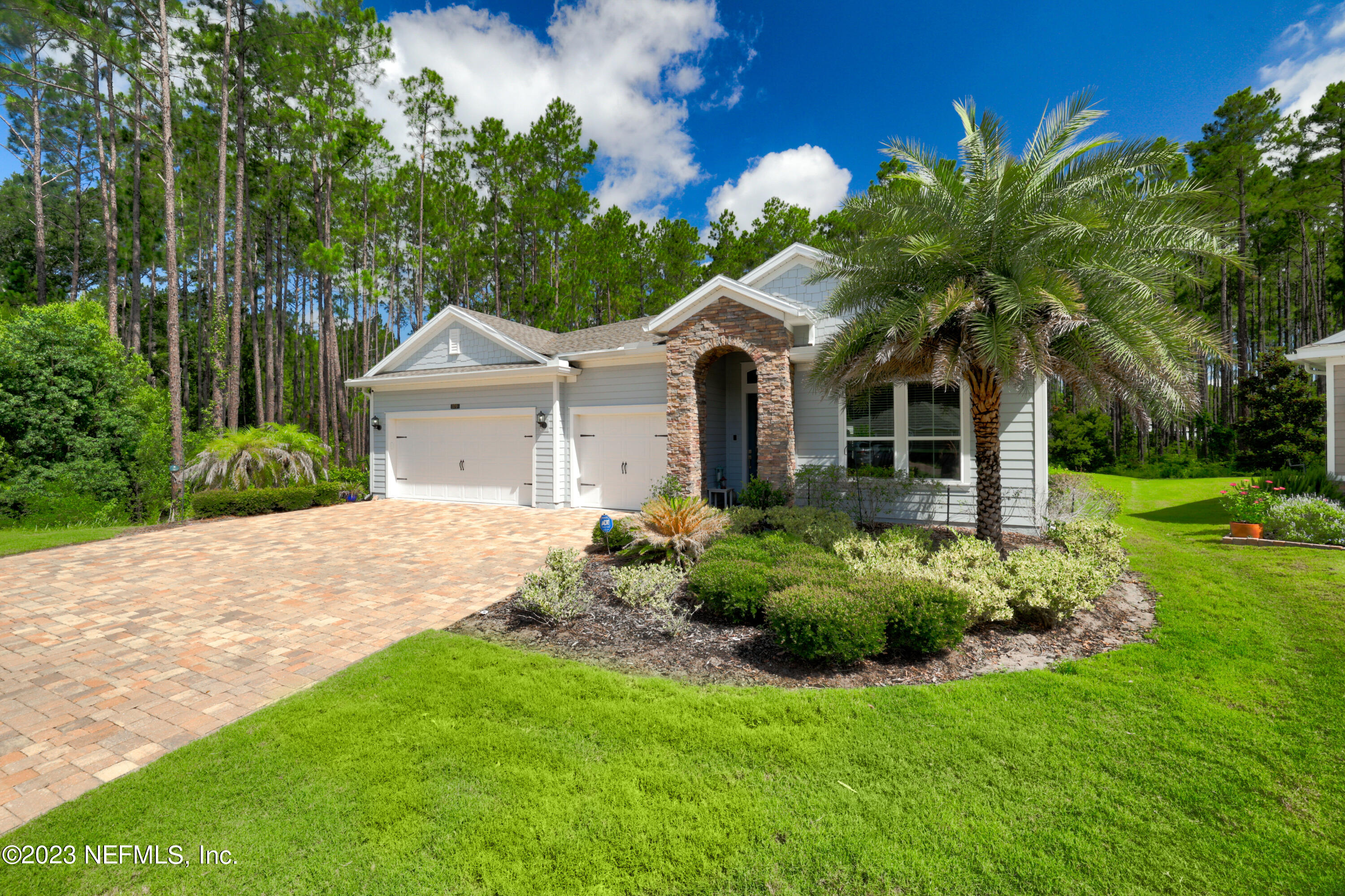 370 Coco Point St. Augustine, FL 32092 - Photo 40 of 48 a front view of a house with a garden