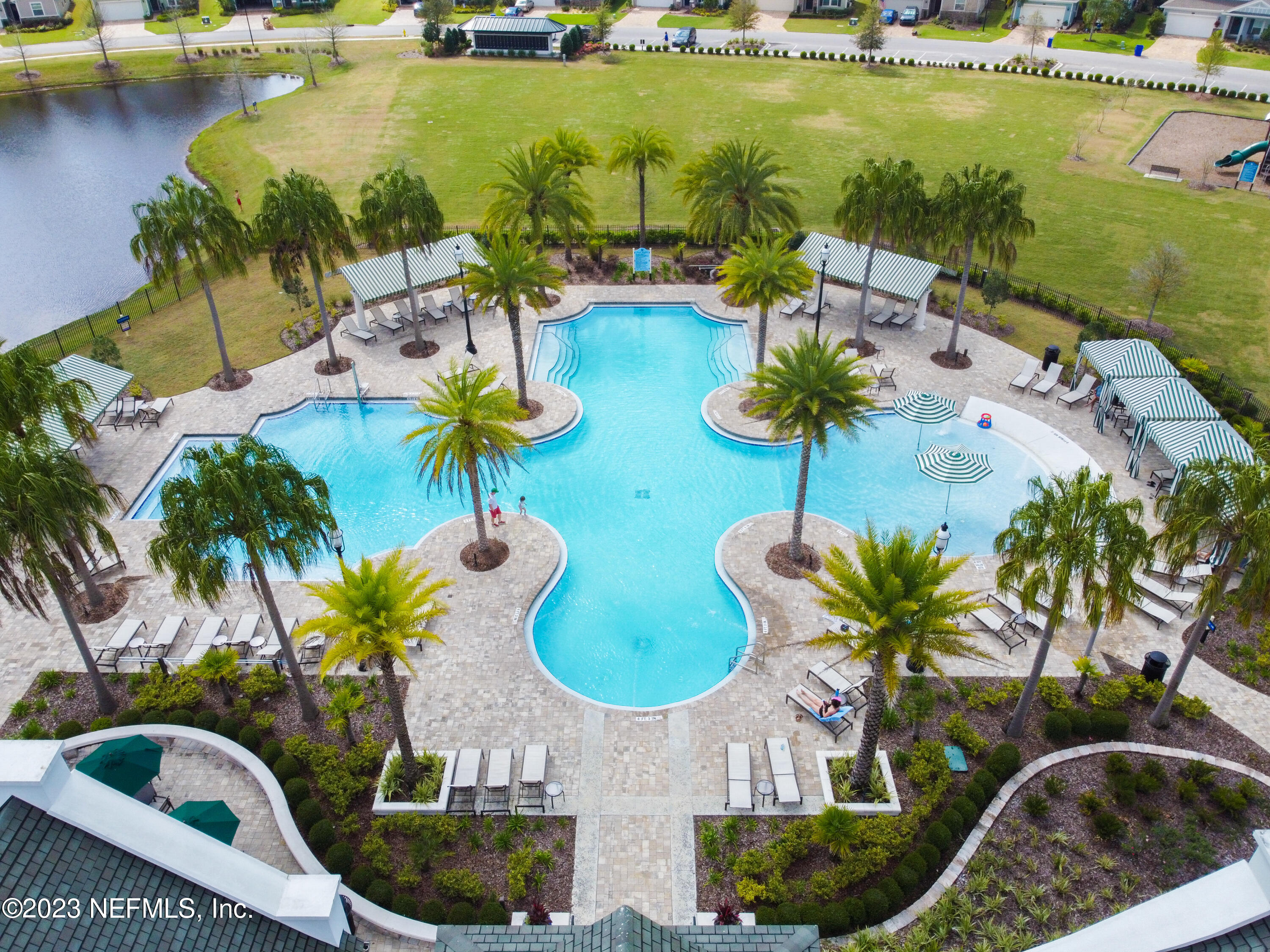 370 Coco Point St. Augustine, FL 32092 - Photo 46 of 48 a view of a swimming pool with a table and chairs