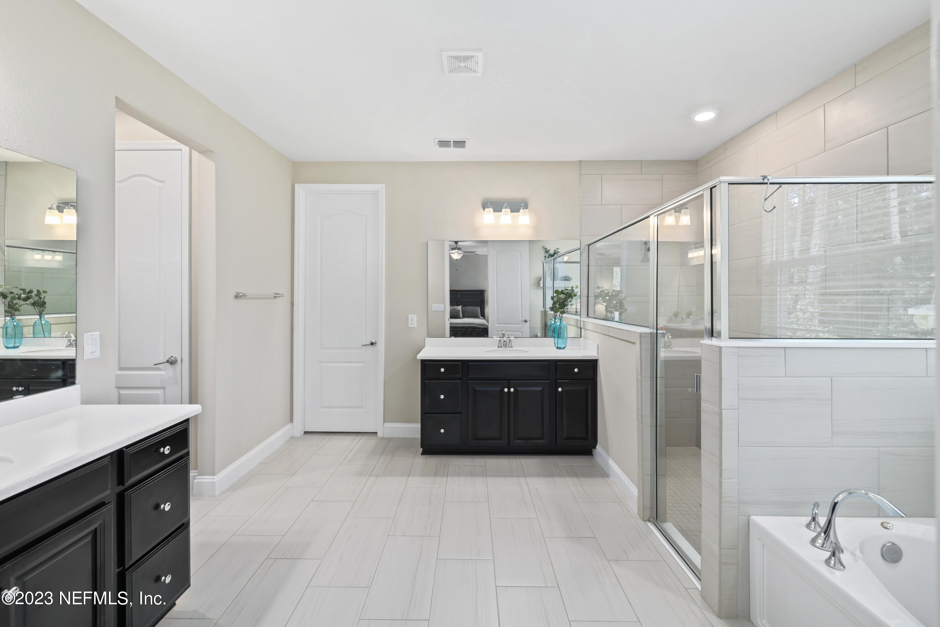 370 Coco Point St. Augustine, FL 32092 - Photo 5 of 48 a spacious bathroom with a tub sink and mirror