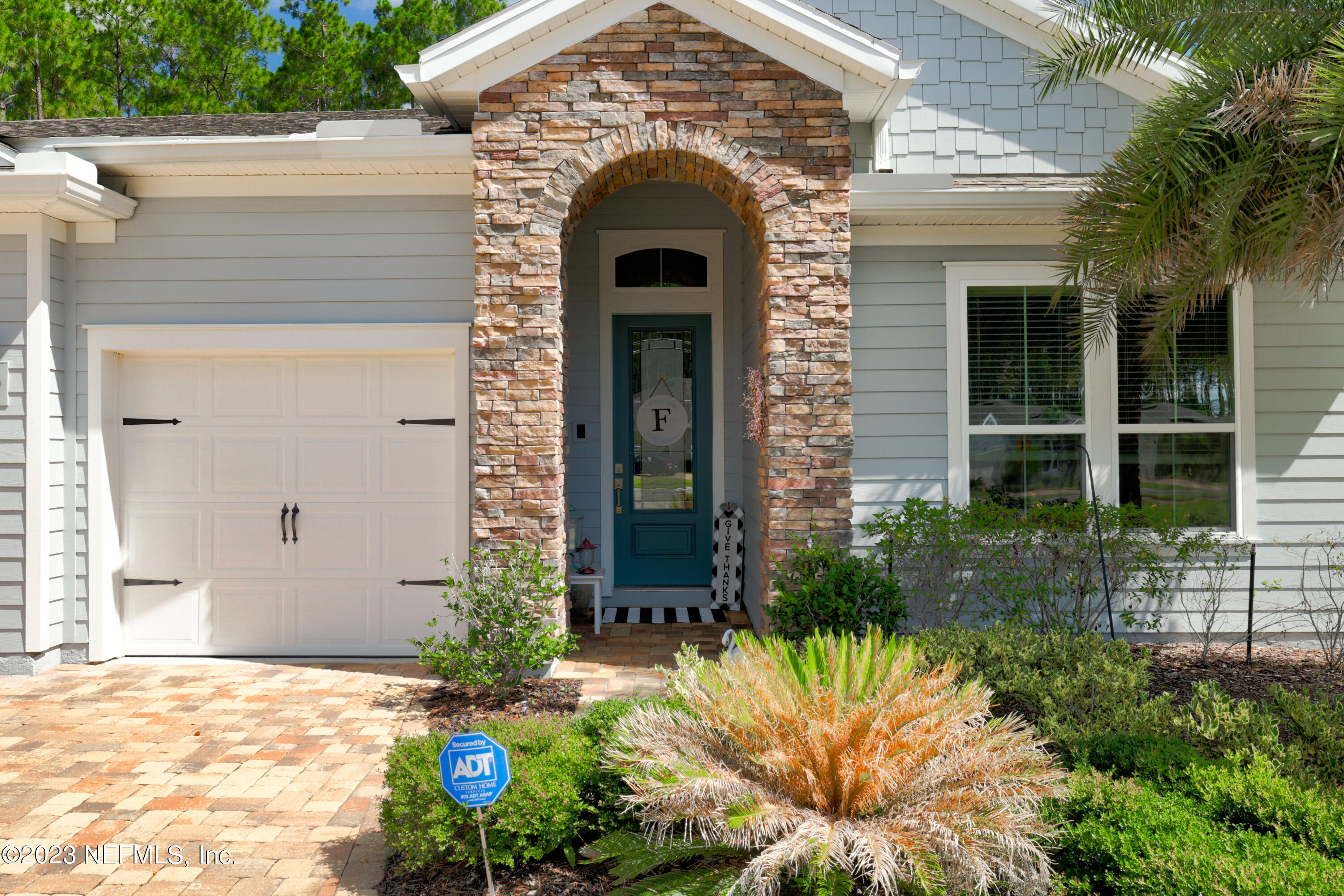 370 Coco Point St. Augustine, FL 32092 - Photo 6 of 48 a front view of a house with garden