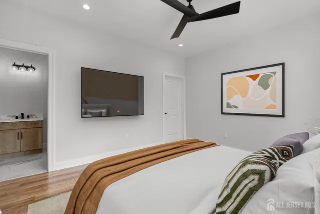 a bedroom with a bed and a dresser