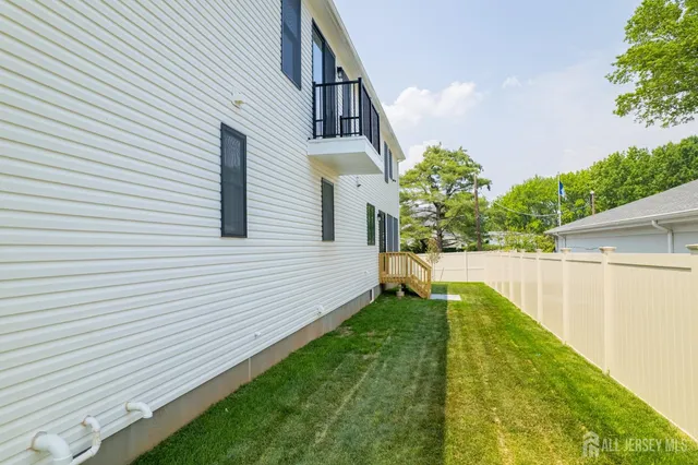 a bathroom with a sink a toilet and a window
