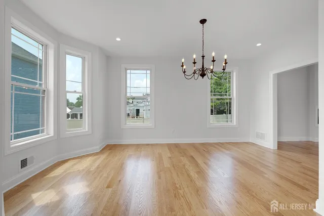 a bathroom with a toilet a sink and a mirror