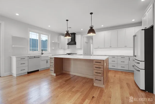 an aerial view of residential house with outdoor space and swimming pool