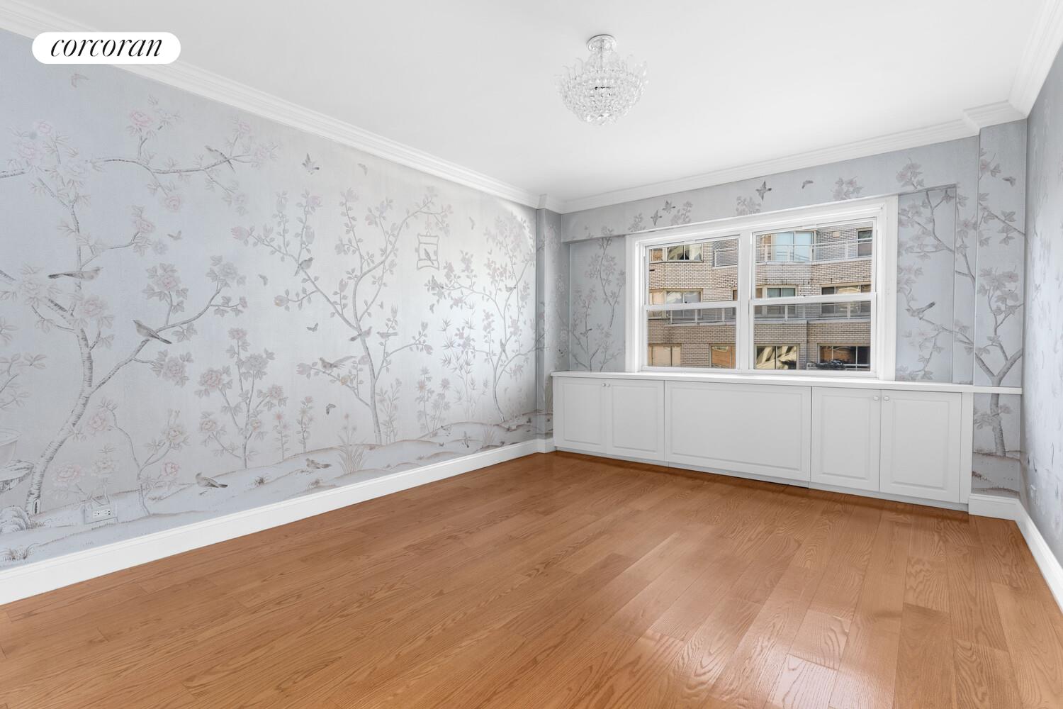 27 East 65th Street, Unit 14D Manhattan, NY 10065 - Photo 10 of 12 a view of an empty room with a window