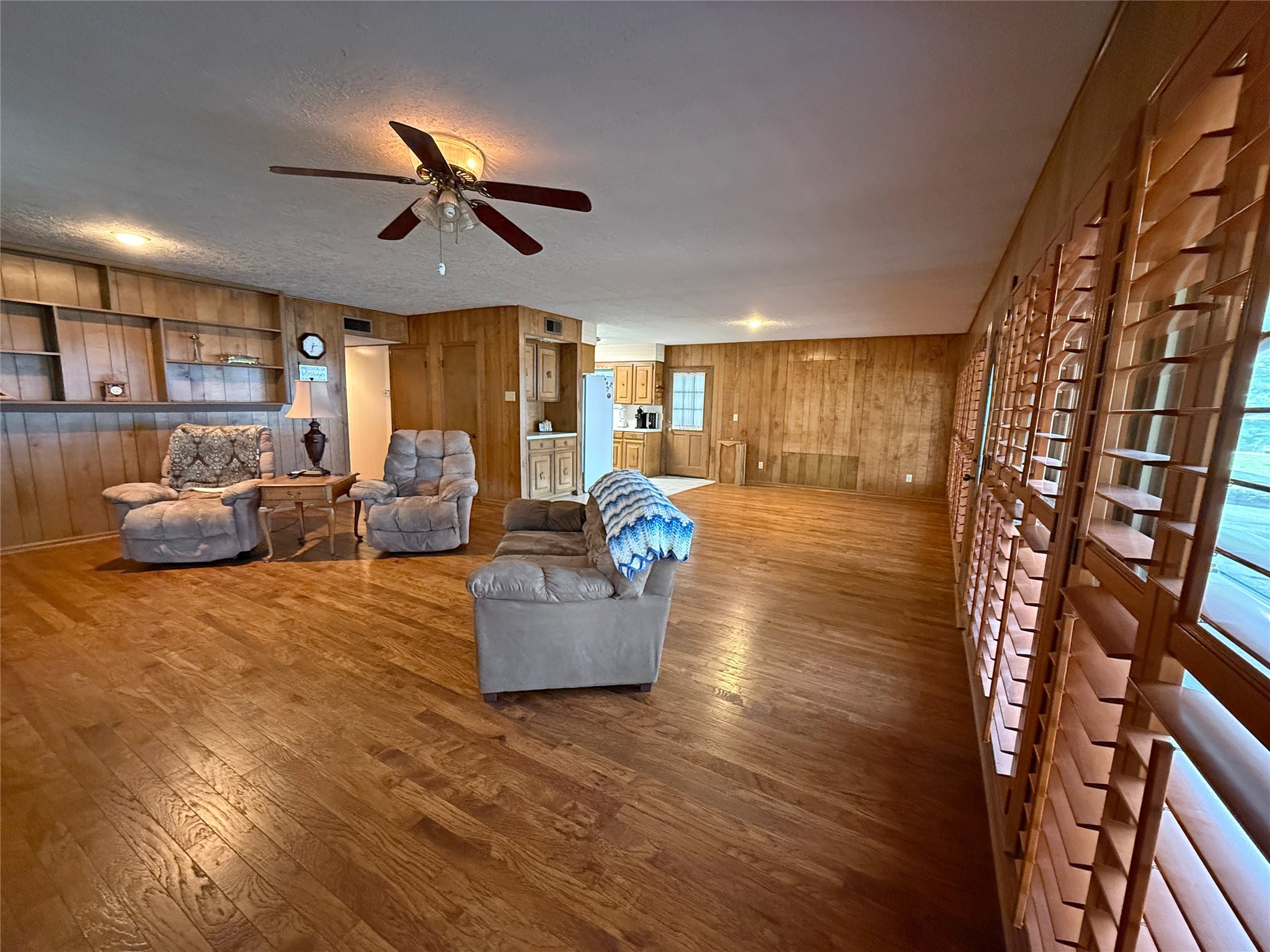 192 Sam Houston Loop Point Blank, TX 77364 - Photo 3 of 42 View from the front corner of the living room toward the dining area and kitchen.