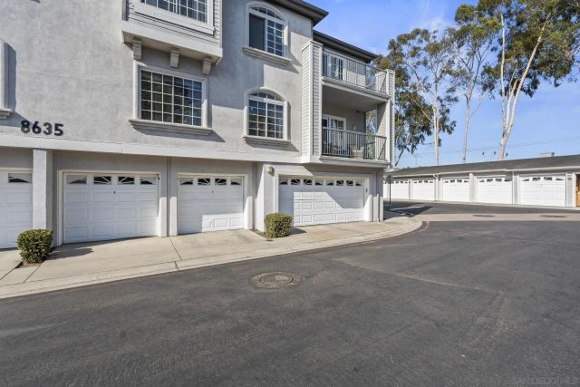 a view of a street with a building in the background