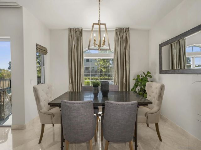 a dining room with furniture and window