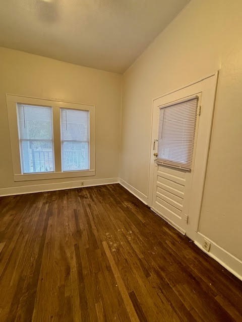210 East Phillips Street Conroe, TX 77301 - Photo 23 of 27 a view of an empty room and wooden floor and a window