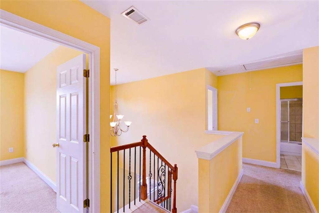 3420 Bulloch Lake Road Loganville, GA 30052 - Photo 29 of 57 a view of a hallway with a door and wooden floor
