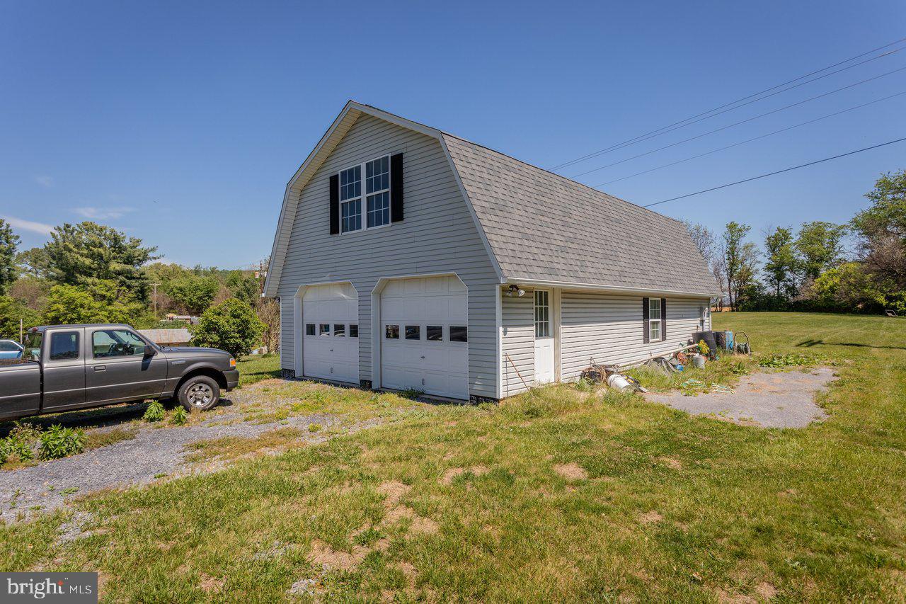 1751 Orchard Road Mount Jackson, VA 22842 - Photo 23 of 30 a view of a house with backyard and sitting area