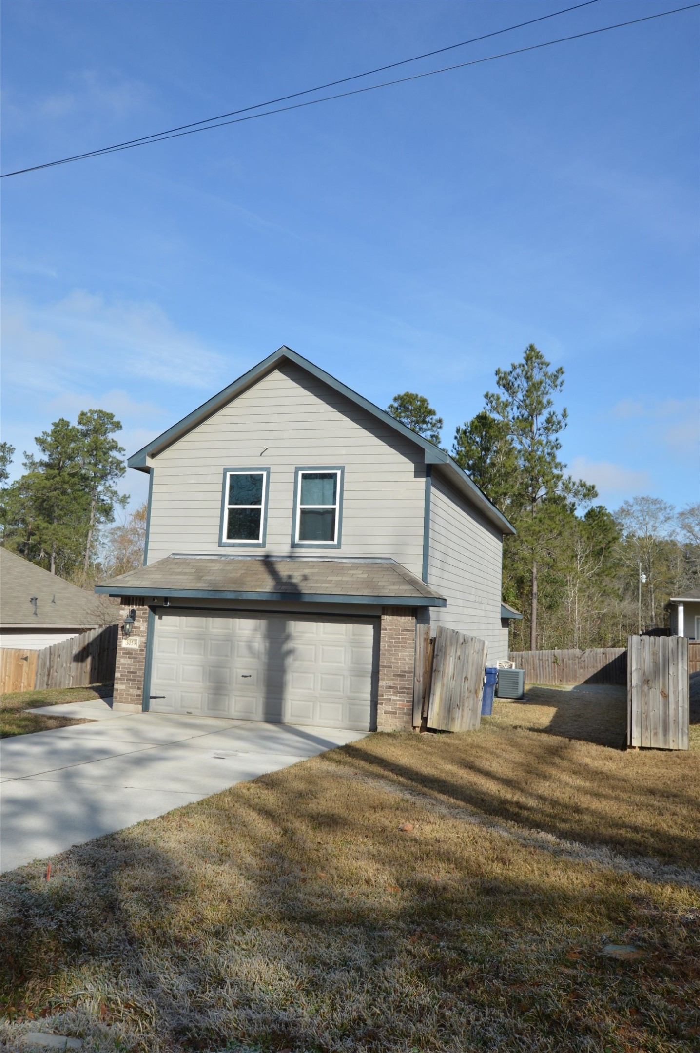 3059 Caddo Willis, TX 77378 - Photo 2 of 27 a view of a house with a yard