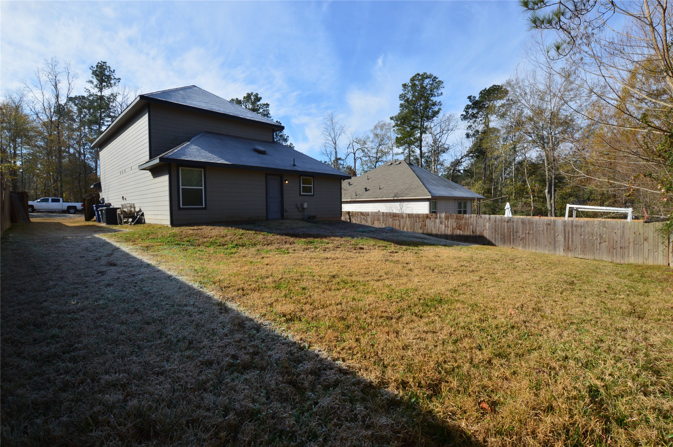 3059 Caddo Willis, TX 77378 - Photo 26 of 27 a view of a house with a yard