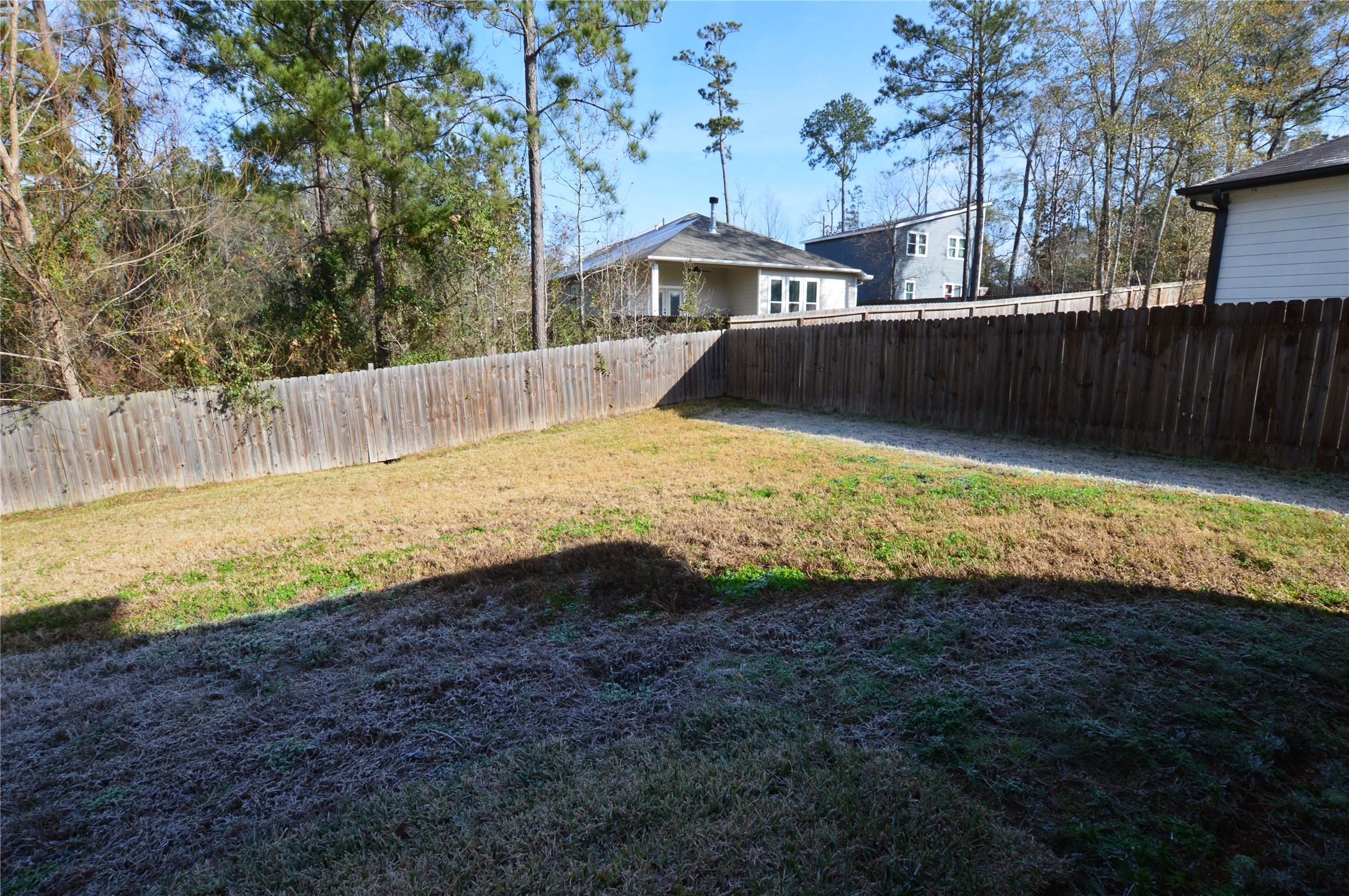 3059 Caddo Willis, TX 77378 - Photo 27 of 27 a view of a house with a yard
