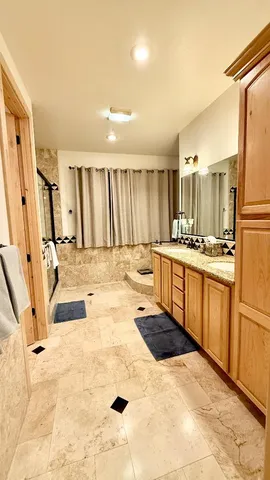 a utility room with sink dryer and washer