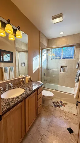 a bedroom with a bed and a desk