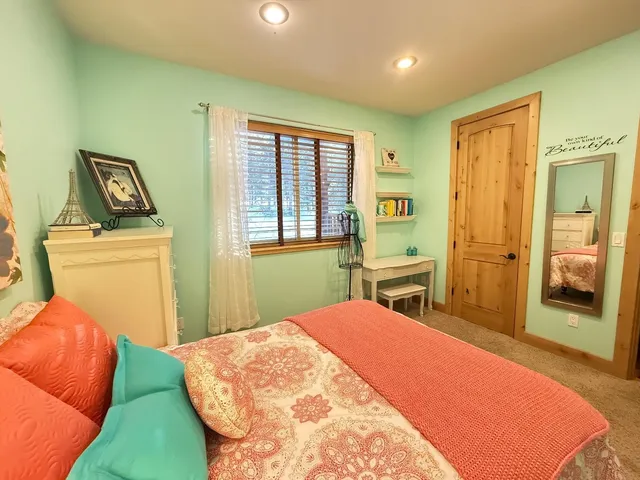a view of a livingroom with furniture and a flat screen tv