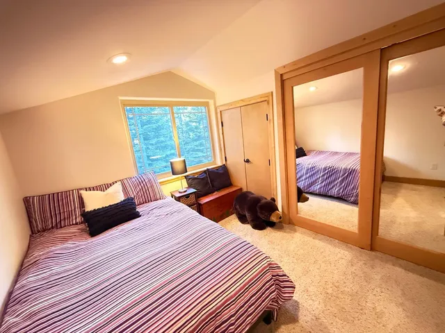 a view of backyard with deck and seating space