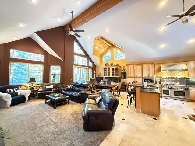 a living room with furniture flat screen tv and a fireplace