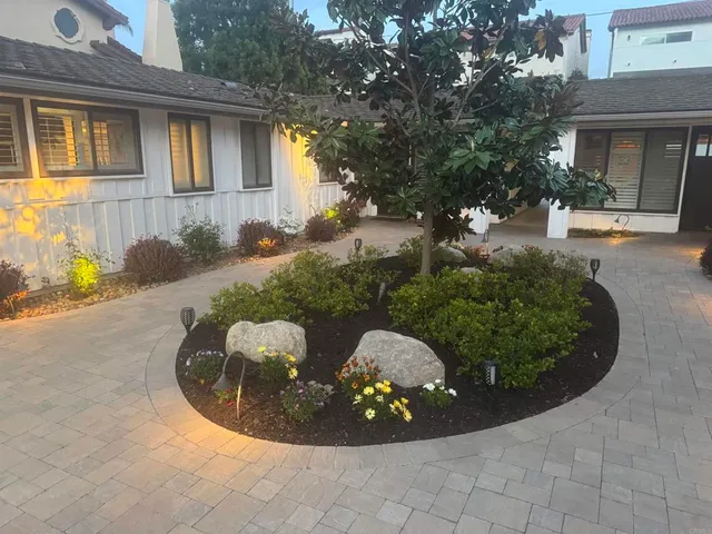 a view of a house with a backyard