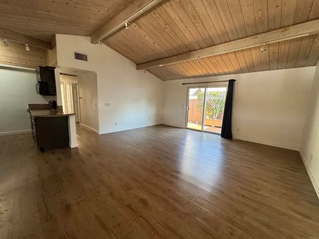 a view of a livingroom with wooden floor