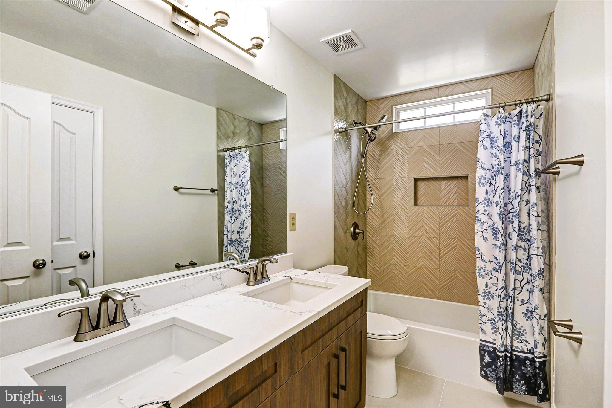 6405 Quiet Night Ride Columbia, MD 21044 - Photo 42 of 63 Newly renovated hall bath has roomy double vanity