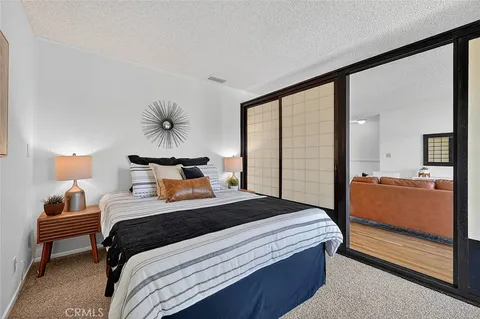 a bedroom with a bed and a walk in closet