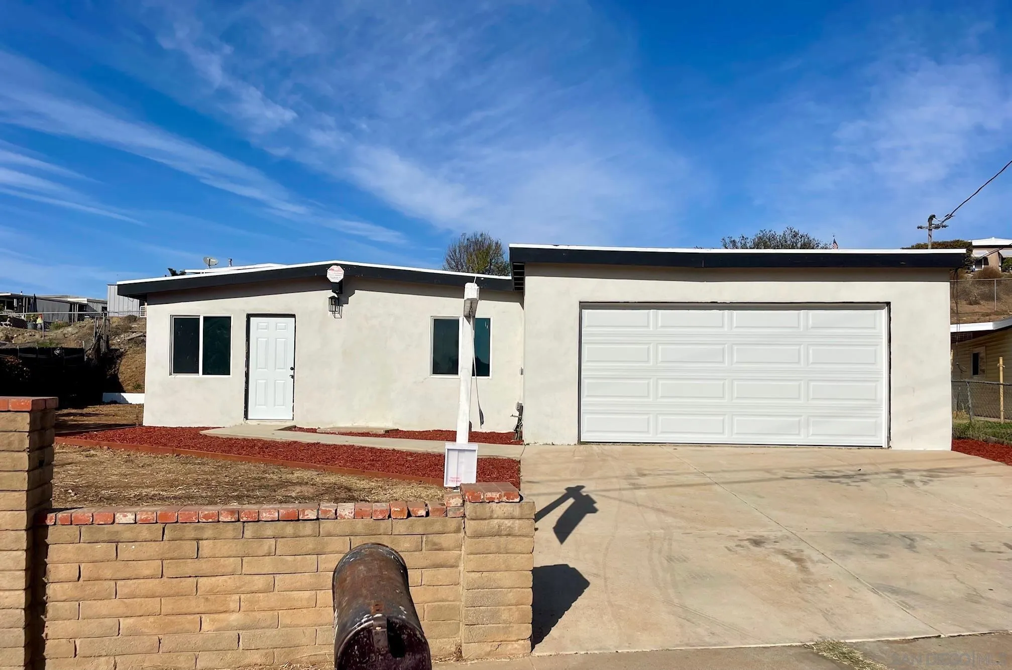 8632 Eileen Street Spring Valley, CA 91977 - Photo 1 of 12 a view of a house with a patio