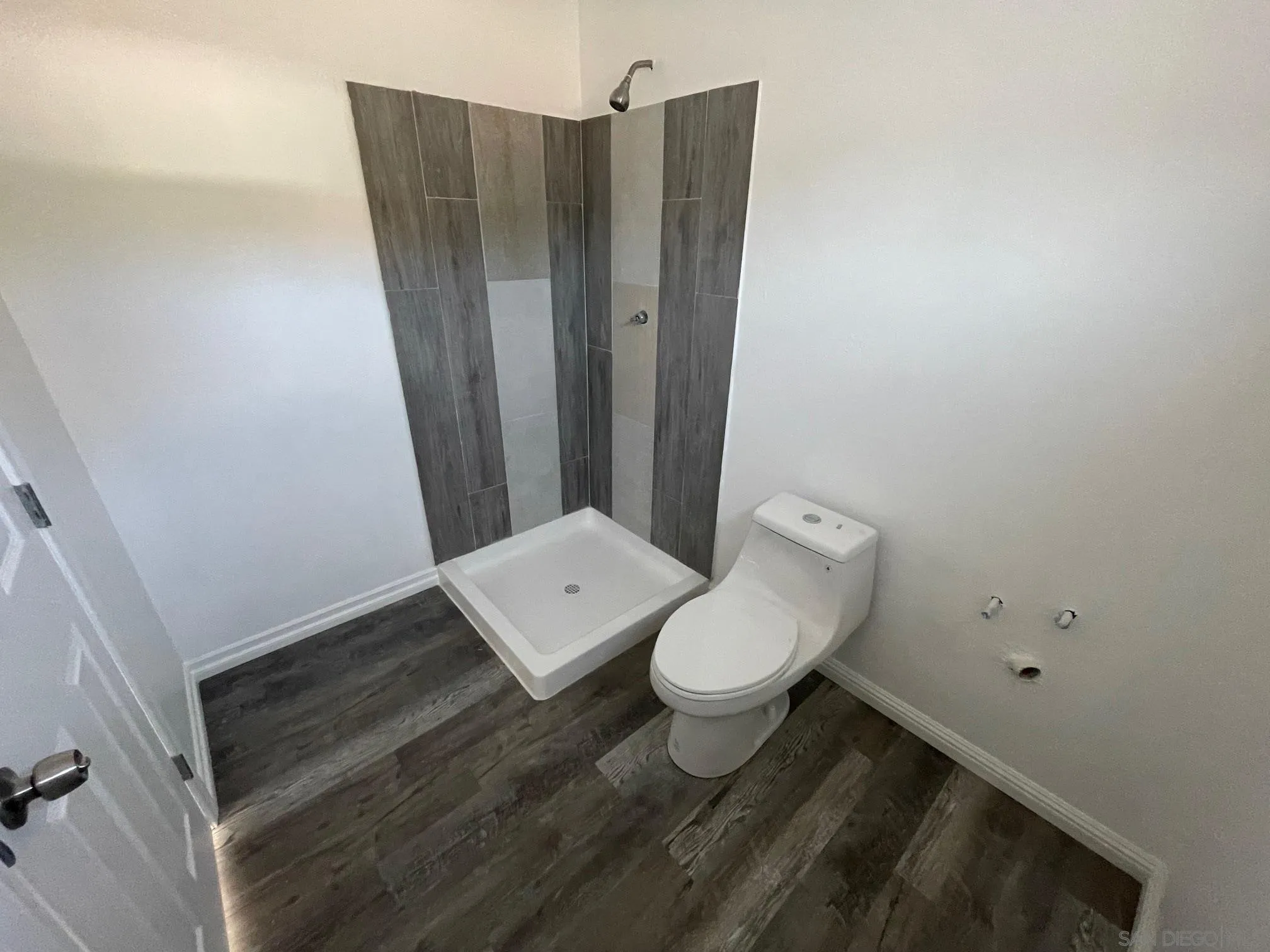 8632 Eileen Street Spring Valley, CA 91977 - Photo 11 of 12 a bathroom with a toilet and a shower