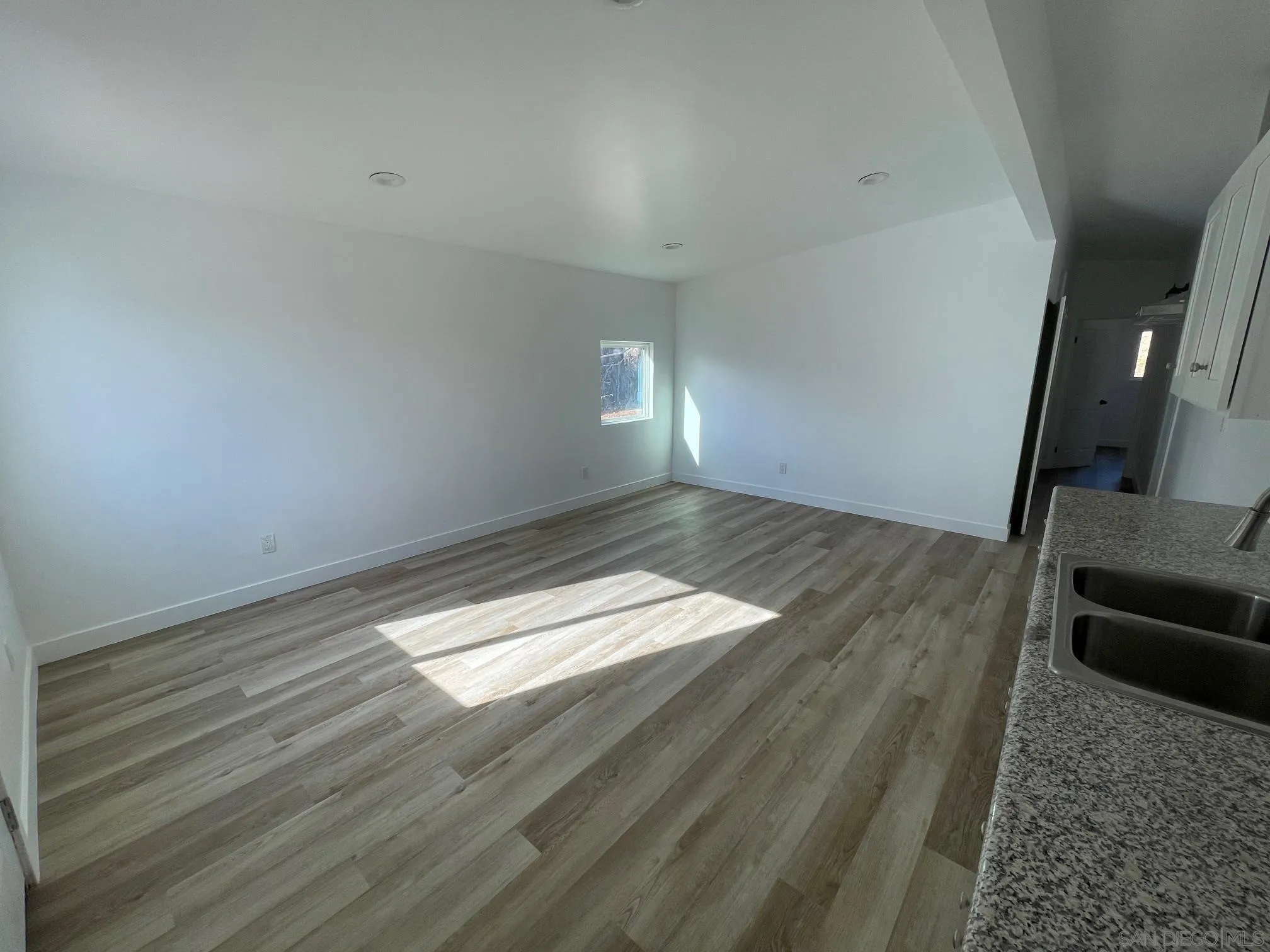 8632 Eileen Street Spring Valley, CA 91977 - Photo 5 of 12 a view of empty room with wooden floor