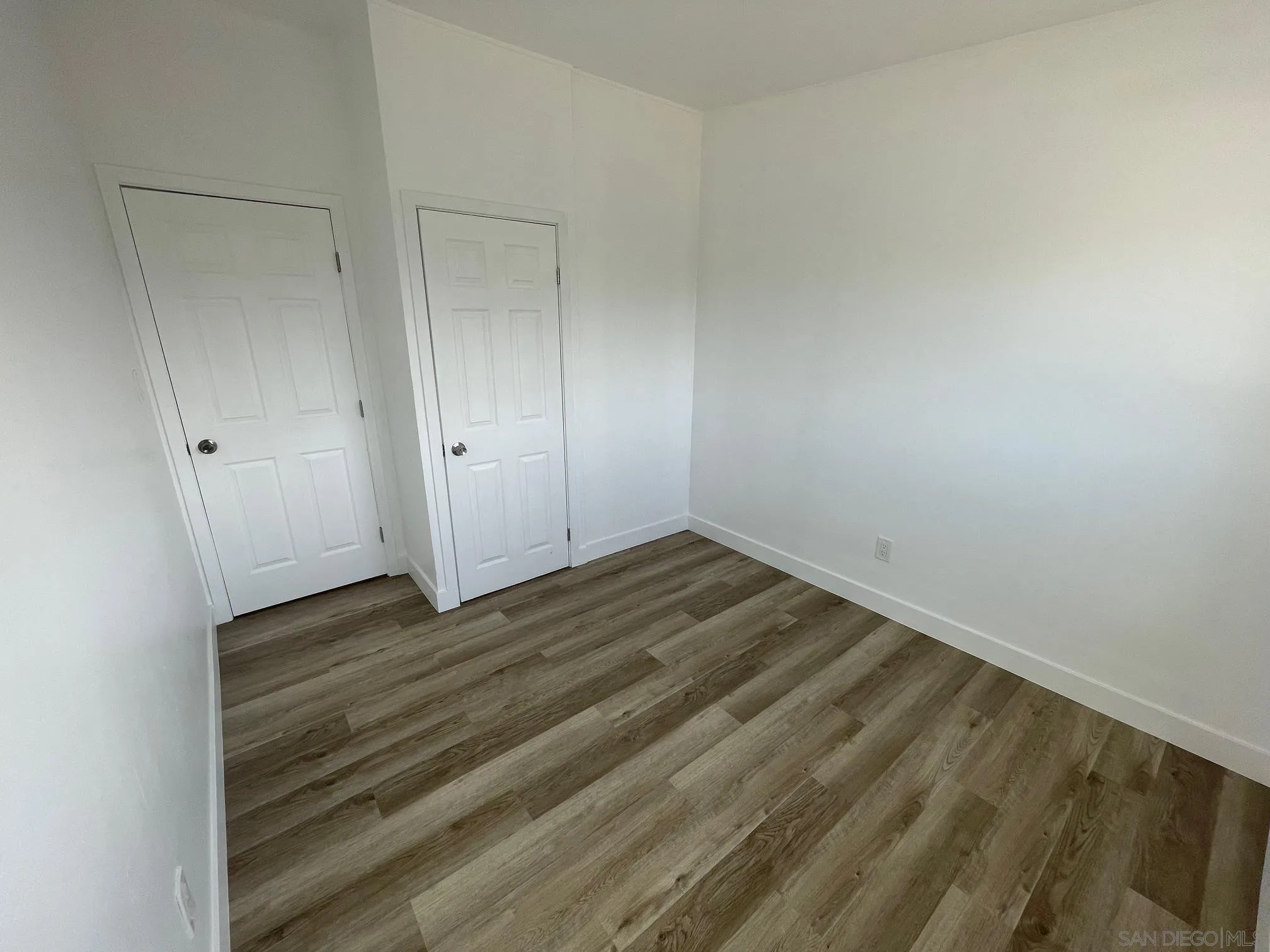 8632 Eileen Street Spring Valley, CA 91977 - Photo 10 of 12 a view of a room with wooden floor