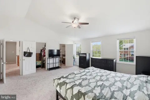a bedroom with furniture and window