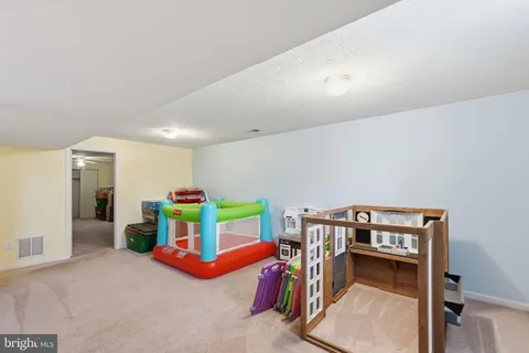 a room with furniture and gym equipment