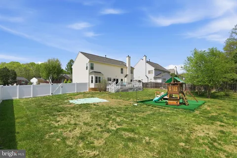 a view of a house with a yard porch and sitting area