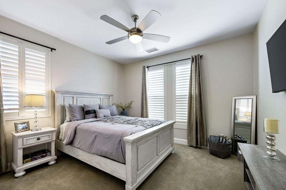 51287 Longmeadow Street Indio, CA 92201 - Photo 16 of 22 a bedroom with a bed and a window